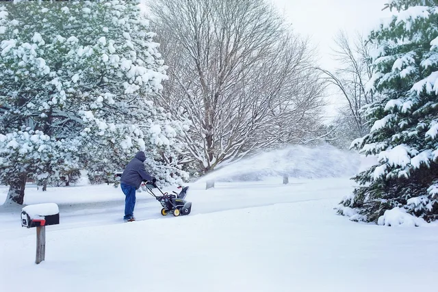 snow, snow blowing, snowblower, snow removal, weather, winter, cold, blower, outdoors, nature, season, snowstorm. Winter operations for junk removal crews in the Prairie provinces